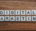 digital marketing artwork on brown wooden surface